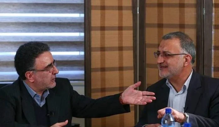 Alireza Zakani (right) debating with former Interior Minister Mostafa Tajzadeh (left)