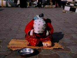 A young girl in Iran begs on the street to help support her family