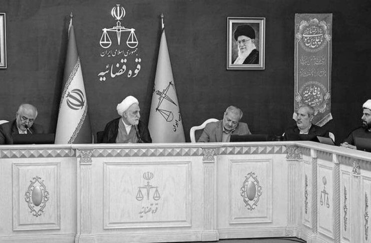 Iranian regime’s Judiciary Chief Gholam Hossein Mohseni Ejei (middle) talks with other judicial officials at a meeting — May 2025